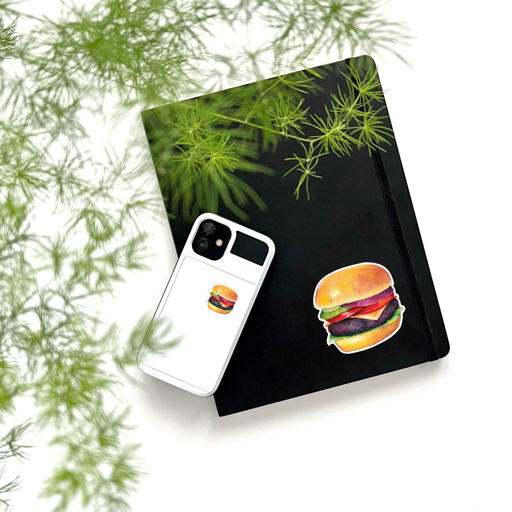 large and small hamburger stickers on phone and notebook
