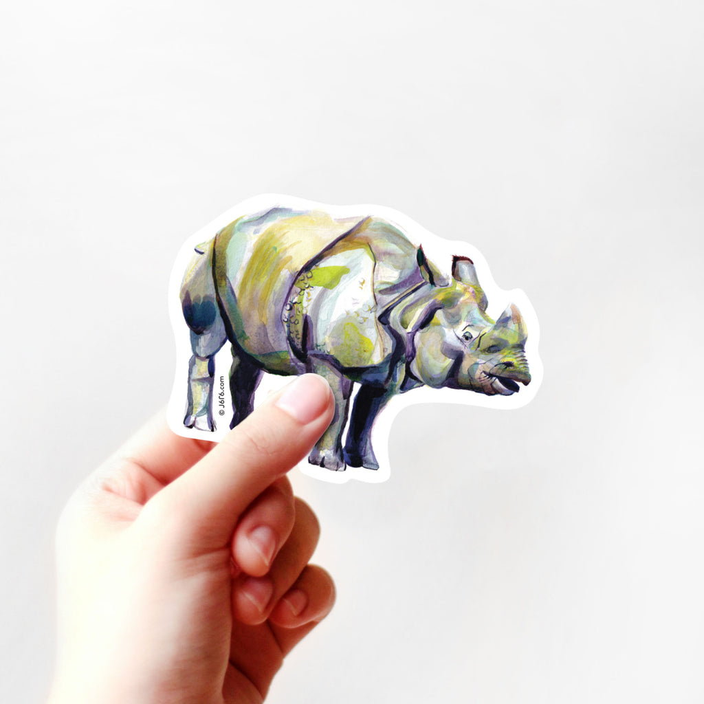 hand holding rhinoceros vinyl sticker