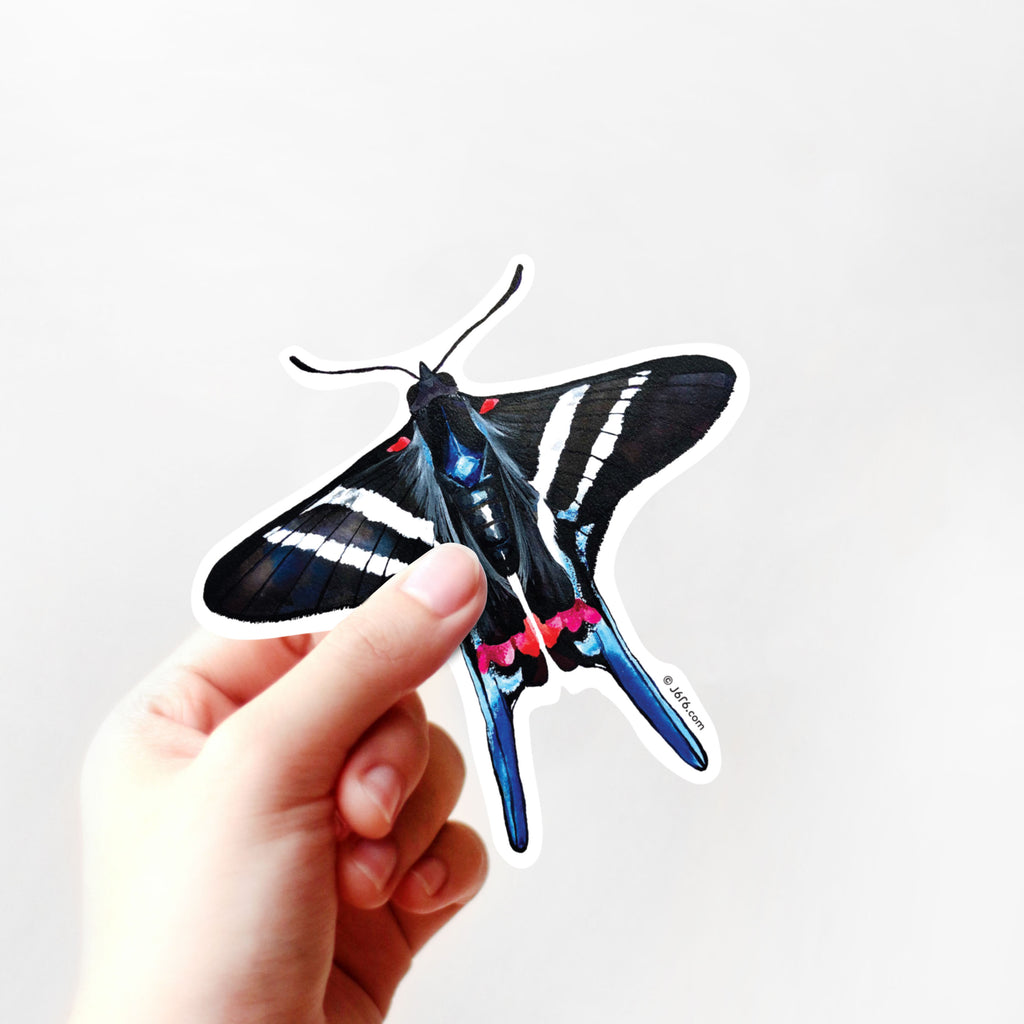 hand holding butterfly sticker