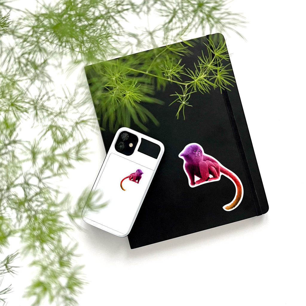 large and small pink monkey on phone and notebook