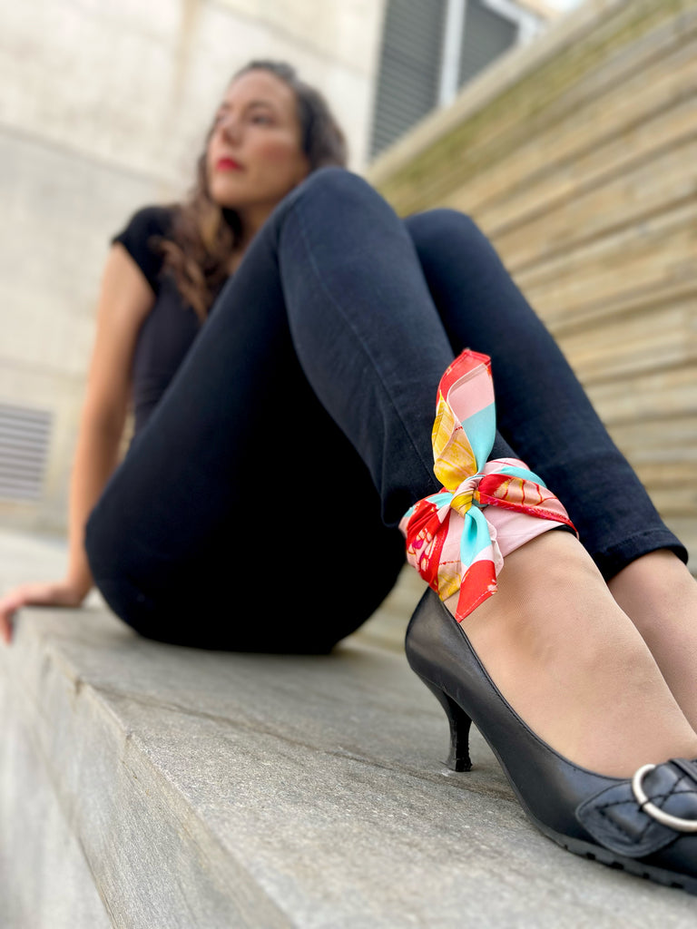 pink and red butterfly scarf on ankle