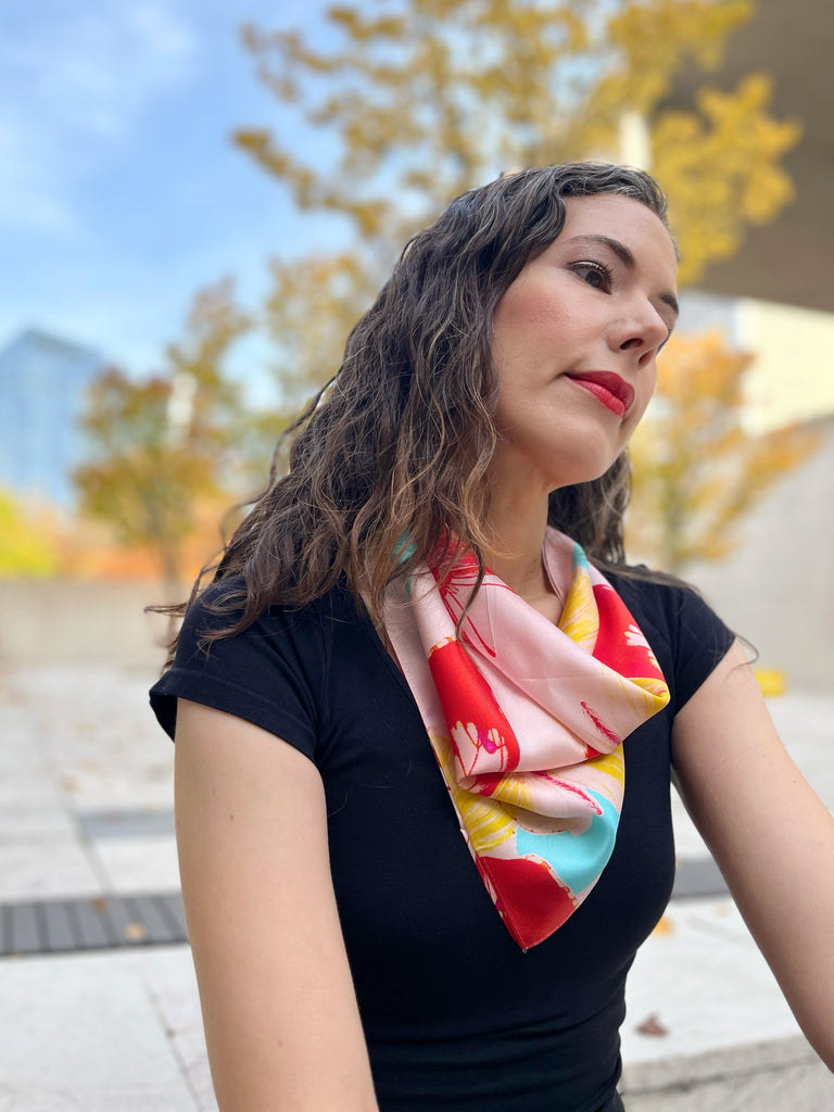 pink and red butterfly bandana on model's neck