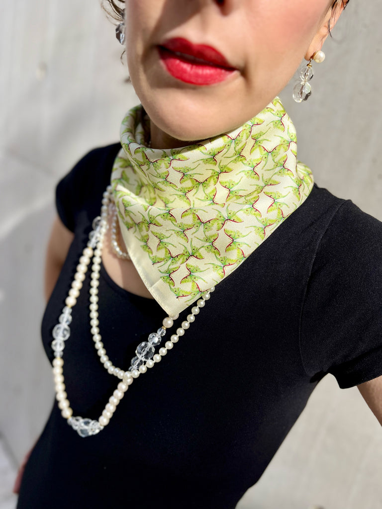 Green luna moth bandana on neck