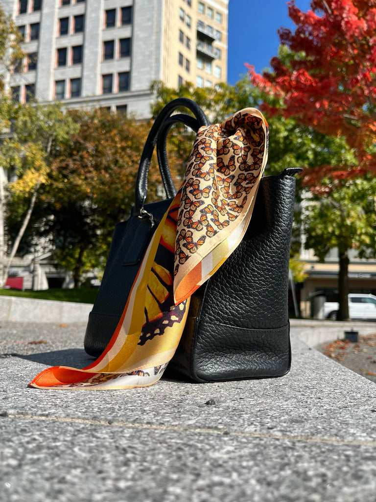 Orange monarch butterfly scarf on purse