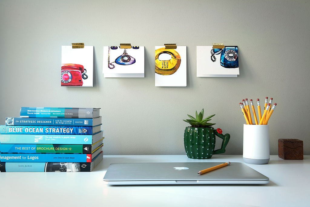 office with red yellow purple blue  phone notecards on wall