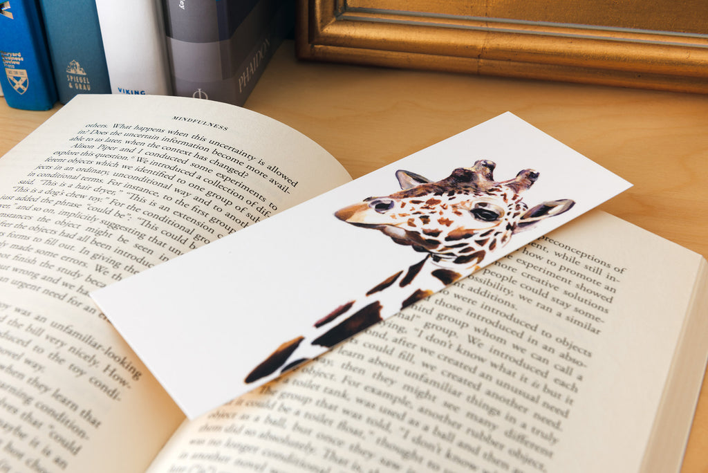 giraffe bookmark in open book