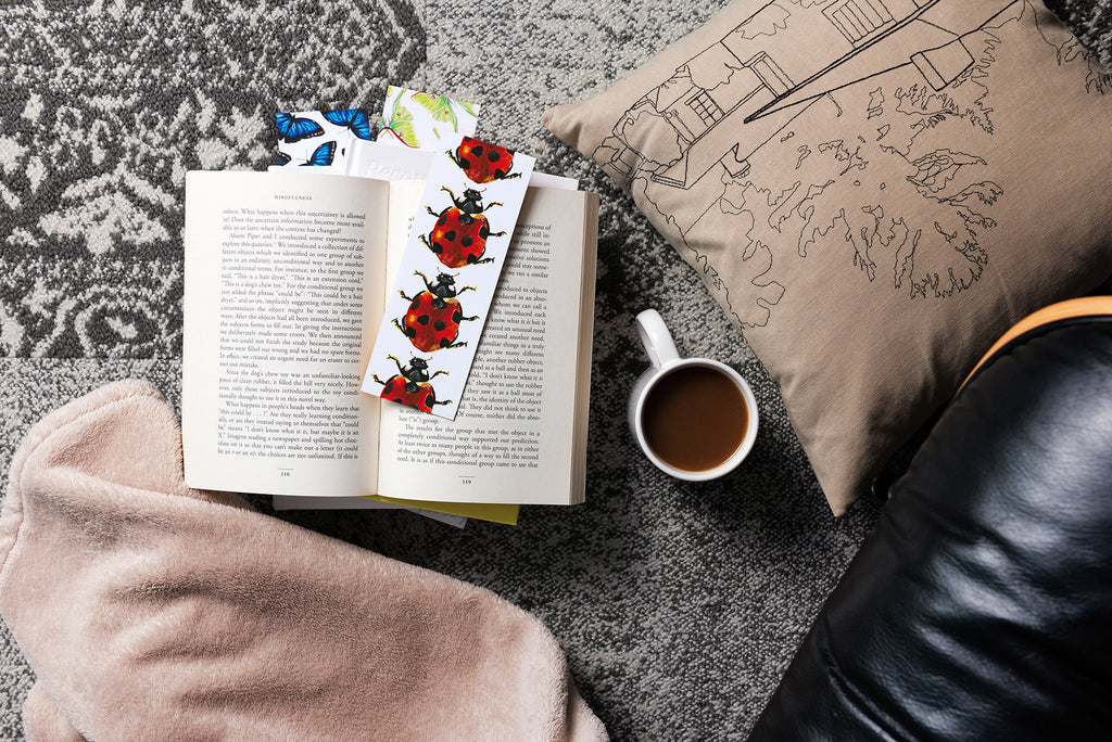butterfly, moth, and ladybug bookmarks in books