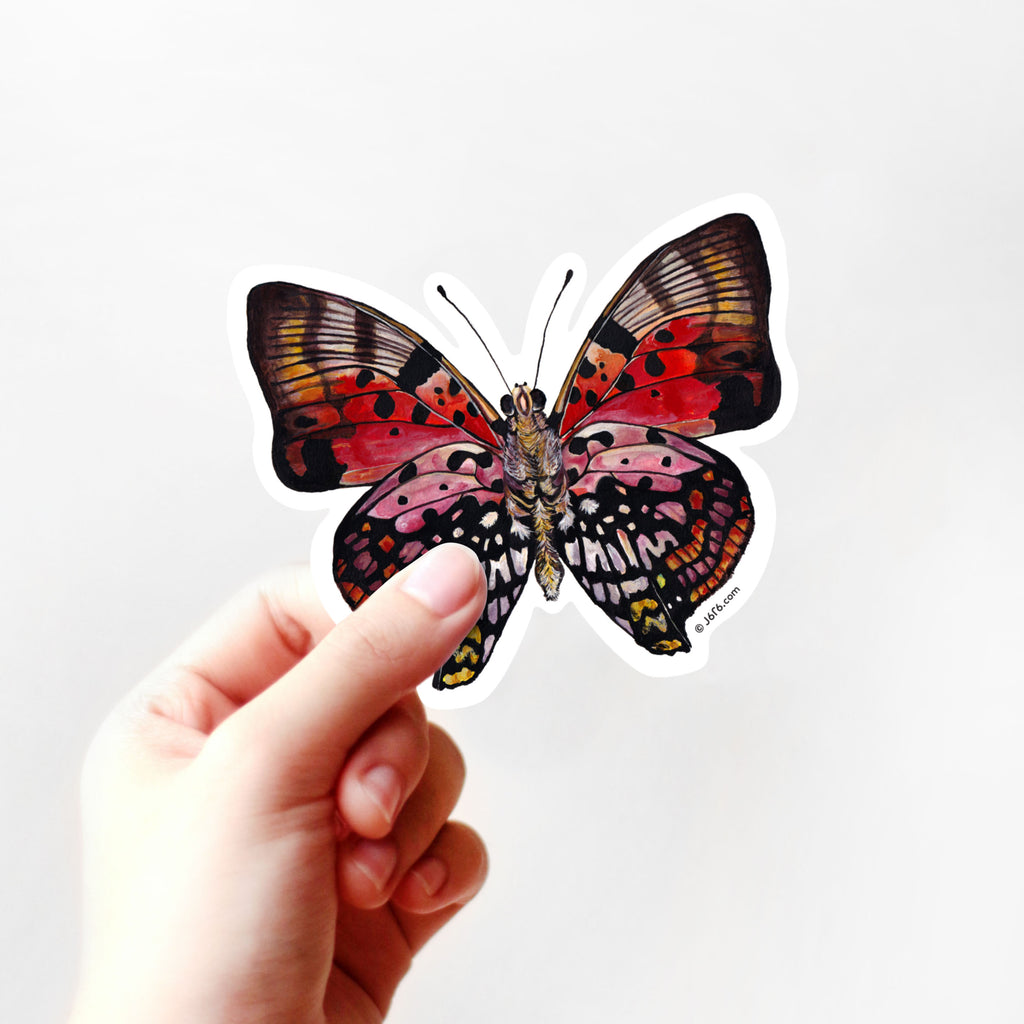 Red butterfly sticker by J6R6 in hand