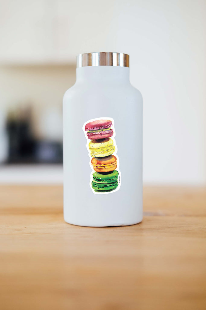 stack of pink, yellow, orange, and green macron vinyl sticker on water bottle